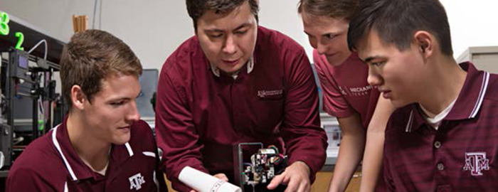 students working on a mechanical engineering project