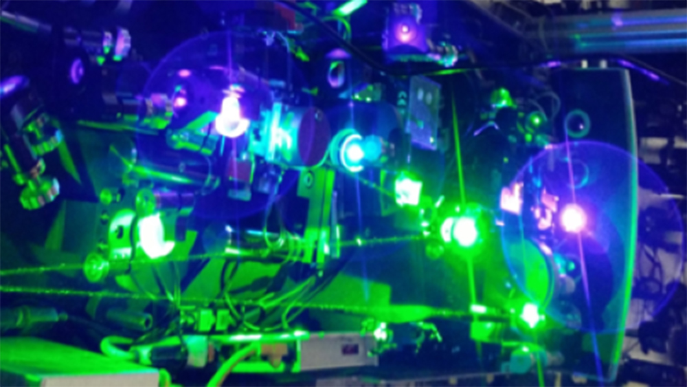 Photonics laboratory equipment with several bright lights.