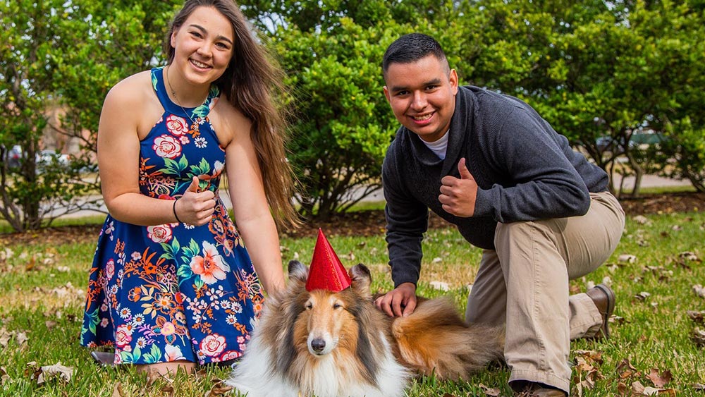 Kaya Mariello and friend pose with Reveille.