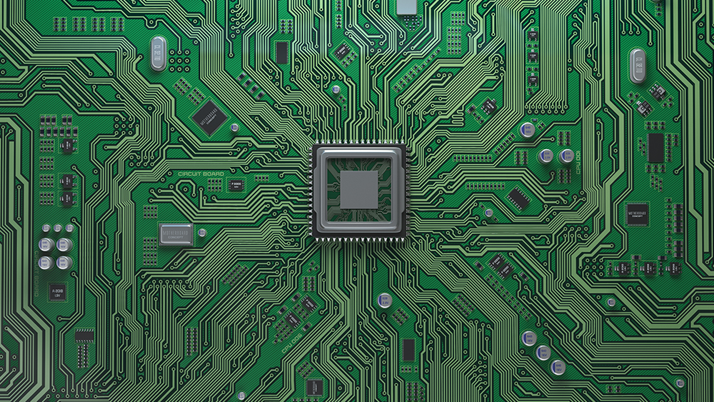 A close-up of a motherboard with a microchip centered in the middle.