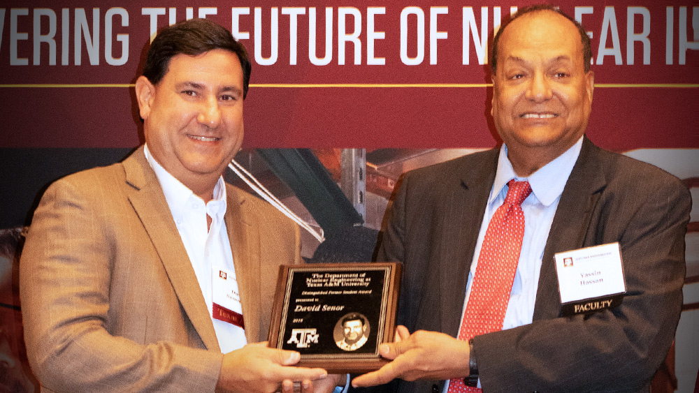 David Senor stands to the left of Yassin Hassan.