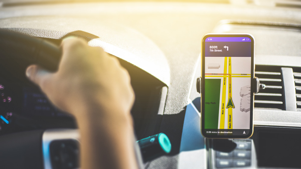 A driver in a vehicle with a navigation system