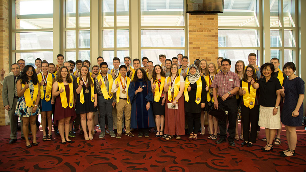 Engineering Honors students pose for a photo after graduation