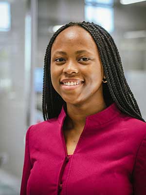 Esu Ekeruche smiling.