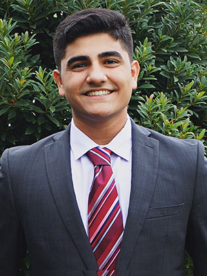 Sameer Hussain smiling.